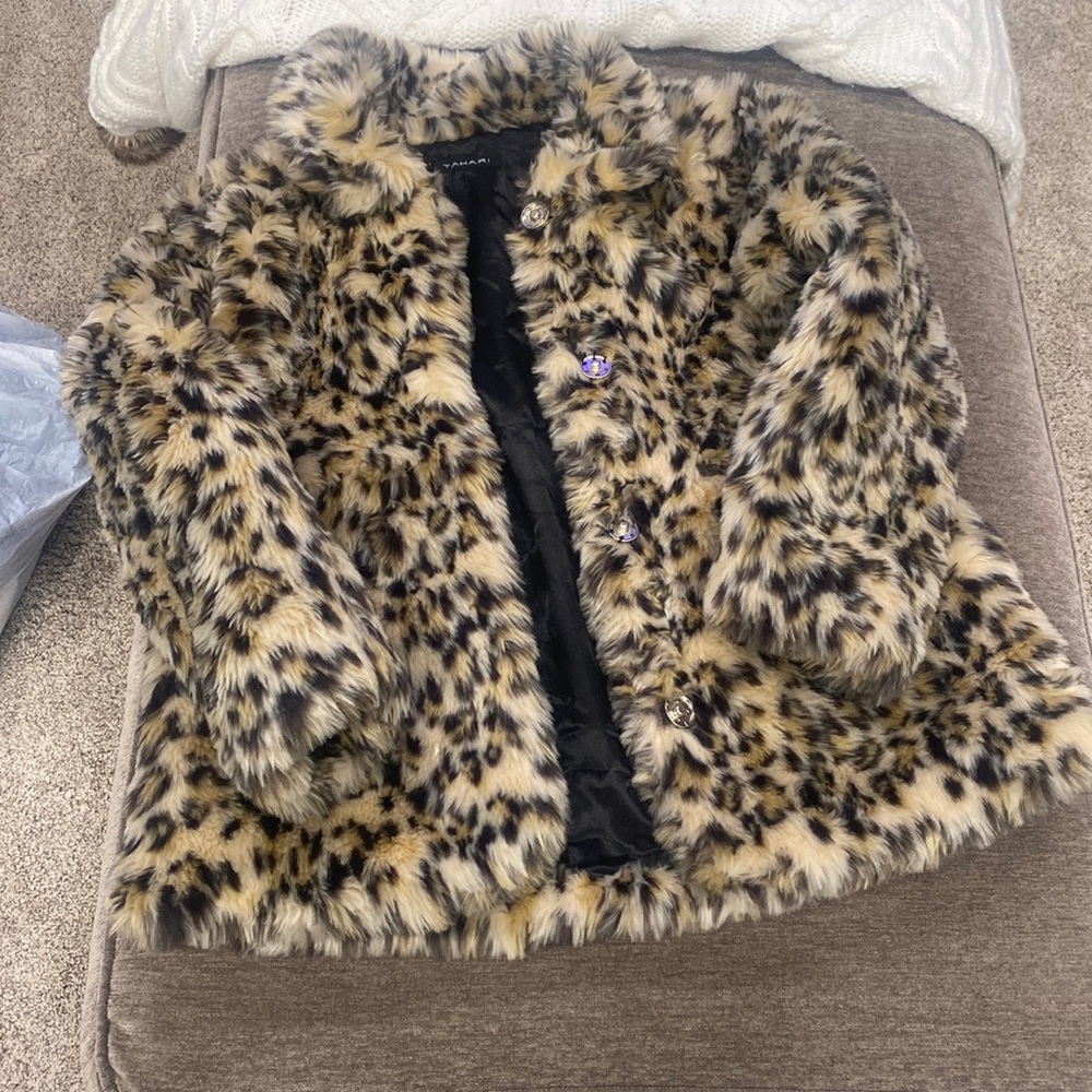This is a cheetah print jacket sold by tahari